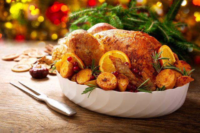 Christmas,Food.,Baked,Turkey,Garnished,With,Potato,,Oranges,And,Cranberries